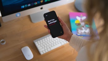 Hand holding iPhone
