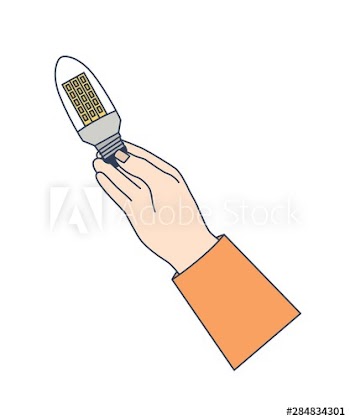 Hand holding LED lamp or light bulb isolated on white background