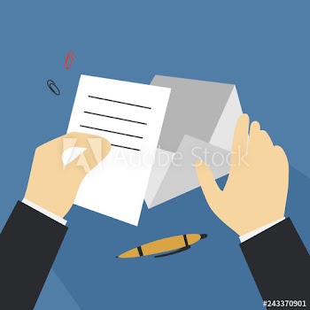 Hand holding letter and put it in envelope