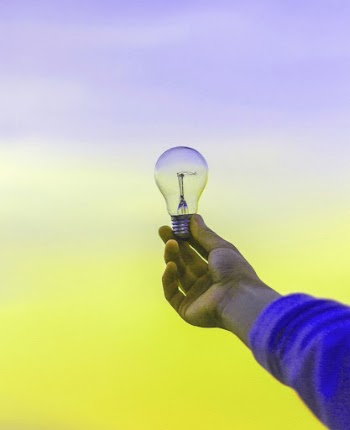 Hand holding light bulb on sunset | Free Photo - rawpixel