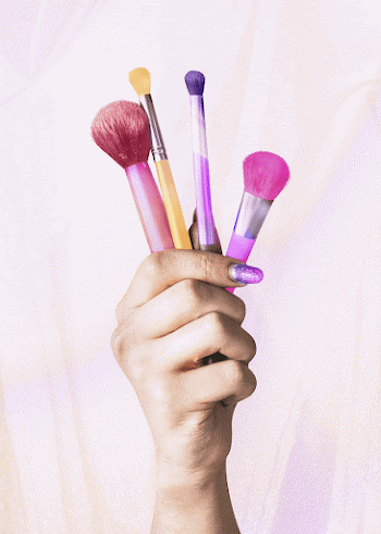 Hand holding makeup brushes, cosmetics | Free Photo - rawpixel