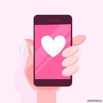 Hand holding mobile phone with a heart sign