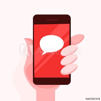 Hand holding mobile phone with a speech bubble sign