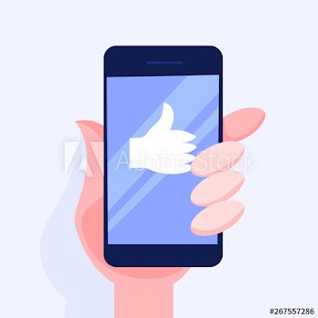 Hand holding mobile phone with a thumbs up