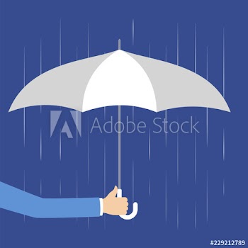 Hand holding white umbrella as metaphor of insurance