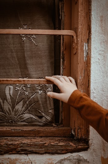 Hand Holding Window