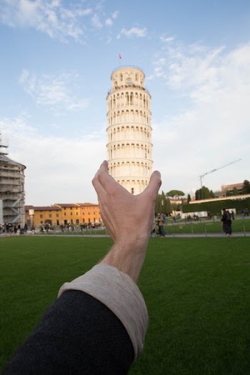 Hand Holds Leaning Tower