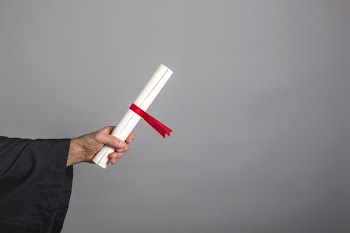 Hand In Gown Holding Diploma