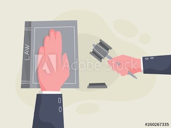 Hand lying on the law book