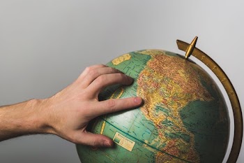 Hand On Globe