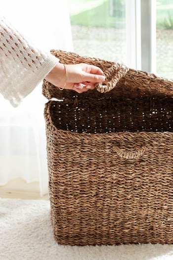 Hand Opening a Rustic Woven Storage Basket