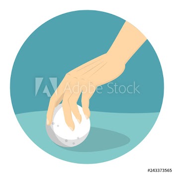 Hand put white golf ball on field