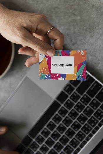 Handing out a business card mockup Free Psd
