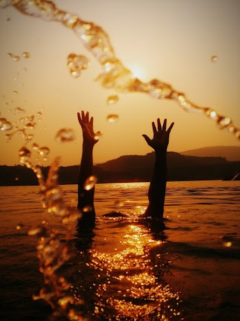 Hands Above Water