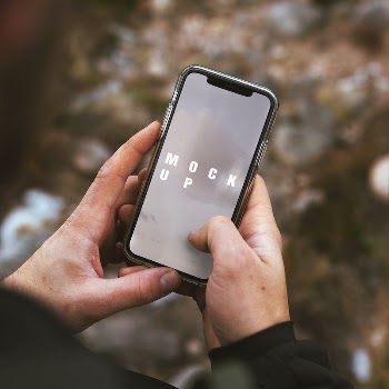Hands holding a smartphone outdoors | Free PSD Mockup - rawpixel
