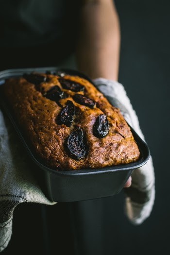 Hands holding VEGAN Fig and Banana bread