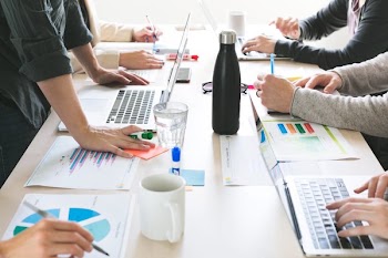 Hands On Desk At Meeting
