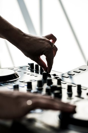 Hands Using DJ Board