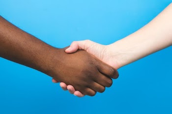 Handshake On Blue