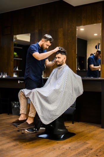 Handsome man getting a new haircut Free Photo