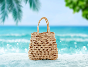 Handwoven Straw Beach Tote Bag on Tropical Sand
