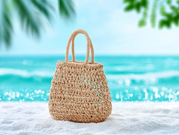 Handwoven Straw Beach Tote on Tropical Sand