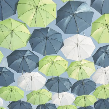 Hanged Green, White, and Gray Umbrellas