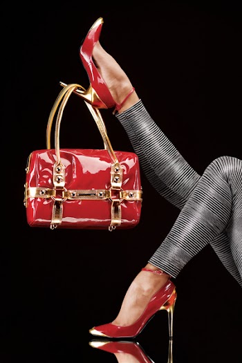Hanged on heel. Stylish red bag hanging on a chic high-heeled shoe.