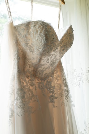 Hanged White Floral Applique Corset Wedding Dress in Between White Window Curtain