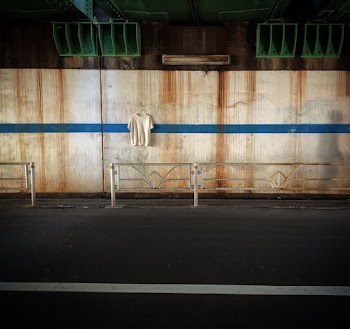 Hanged White T-shirt on Wall