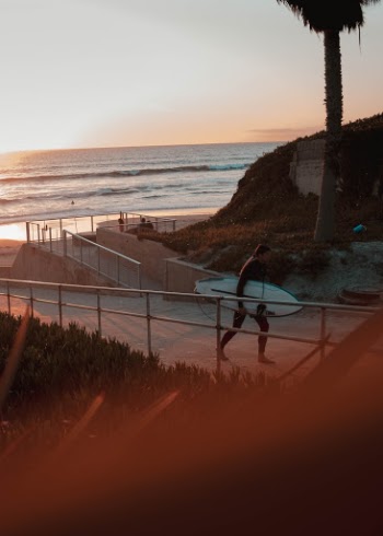 Hanging out around Solana Beach, CA at sunset just time for this surfers session to end.
