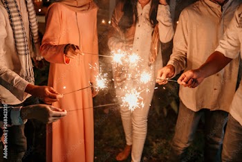happiness lighting the takbir night fireworks with friends while celebrating the Eid holiday