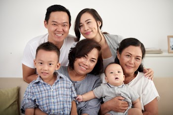 Happy asian family posing together Free Photo