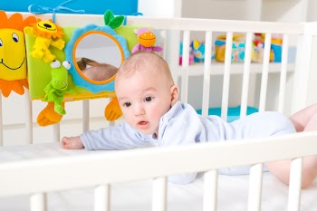 Happy baby on crib