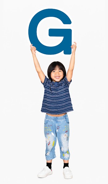 Happy boy holding the letter G | Free stock psd mockup - 491889