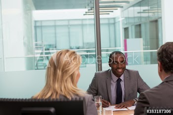 Happy business people talking in conference room meeting