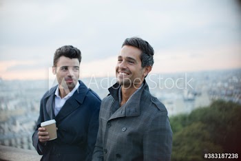 Happy businessmen talking, Montmartre, Paris, France