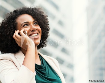 Happy businesswoman talking on the phone