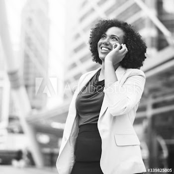 Happy businesswoman talking on the phone