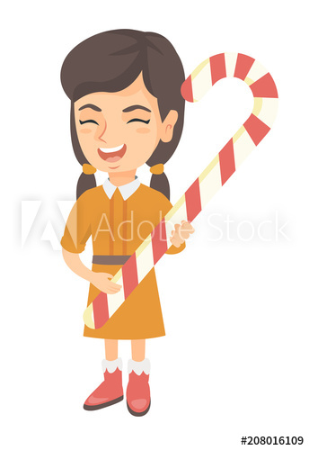Happy caucasian little girl holding a christmas candy cane