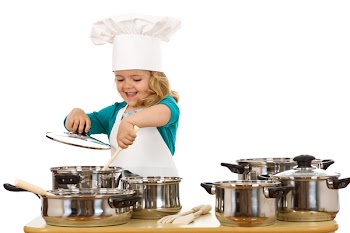 Happy chef girl stirring soup in a bowl - isolated