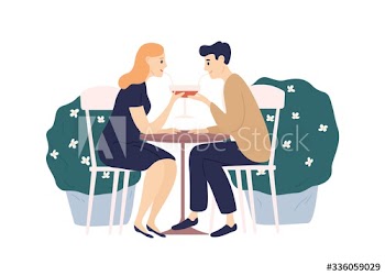 Happy couple drink beverage from one glass using straw sit at table isolated on white