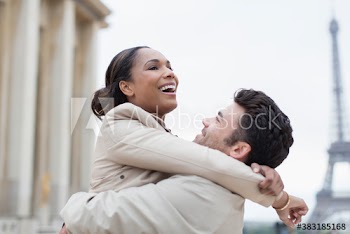 Happy couple hugging near Eiffel Tower, Paris, France