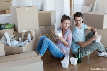 Happy couple taking a break from moving with Chinese takeout food