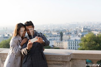 Happy couple taking selfie, Montmartre, Paris, France