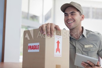 Happy deliveryman with digital tablet and fragile package