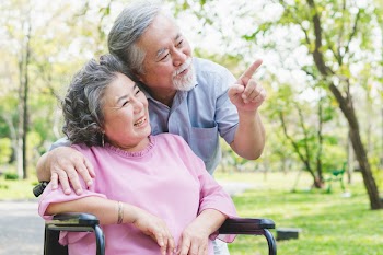 Happy elderly couple with lifestyle after retiree concept. Lovely asian seniors couple embracing together in the park in the morning.
