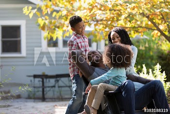 Happy family relaxing on autumn patio