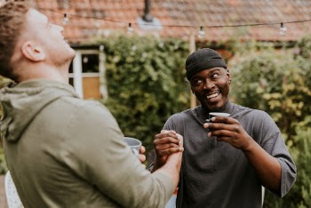 Happy friends arm wrestling with each | Free Photo - rawpixel