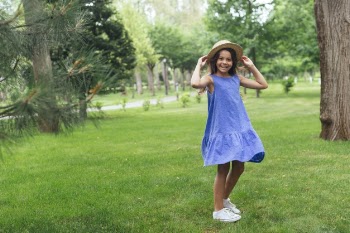 Happy girl posing outdoors Free Photo